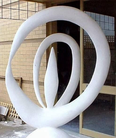 "A Daydream" - Early Abstract Sculpture by Michal Plis (1999) Early abstract sculpture titled "A Daydream" by Melbourne artist Michal Plis, created in 1999. The large, white, curved sculpture is constructed from wire, concrete, plaster, and wood, featuring a central flame-like shape surrounded by interlocking circula